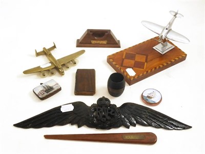 Lot 22 - Assorted collectables including RAF crest, aeroplane deskweight, historical oak treen, souvenir...