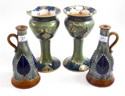 Lot 27 - A pair of Macintyre Moorcroft vases and a pair of Royal Doulton stoneware ewers (4) (a.f.)