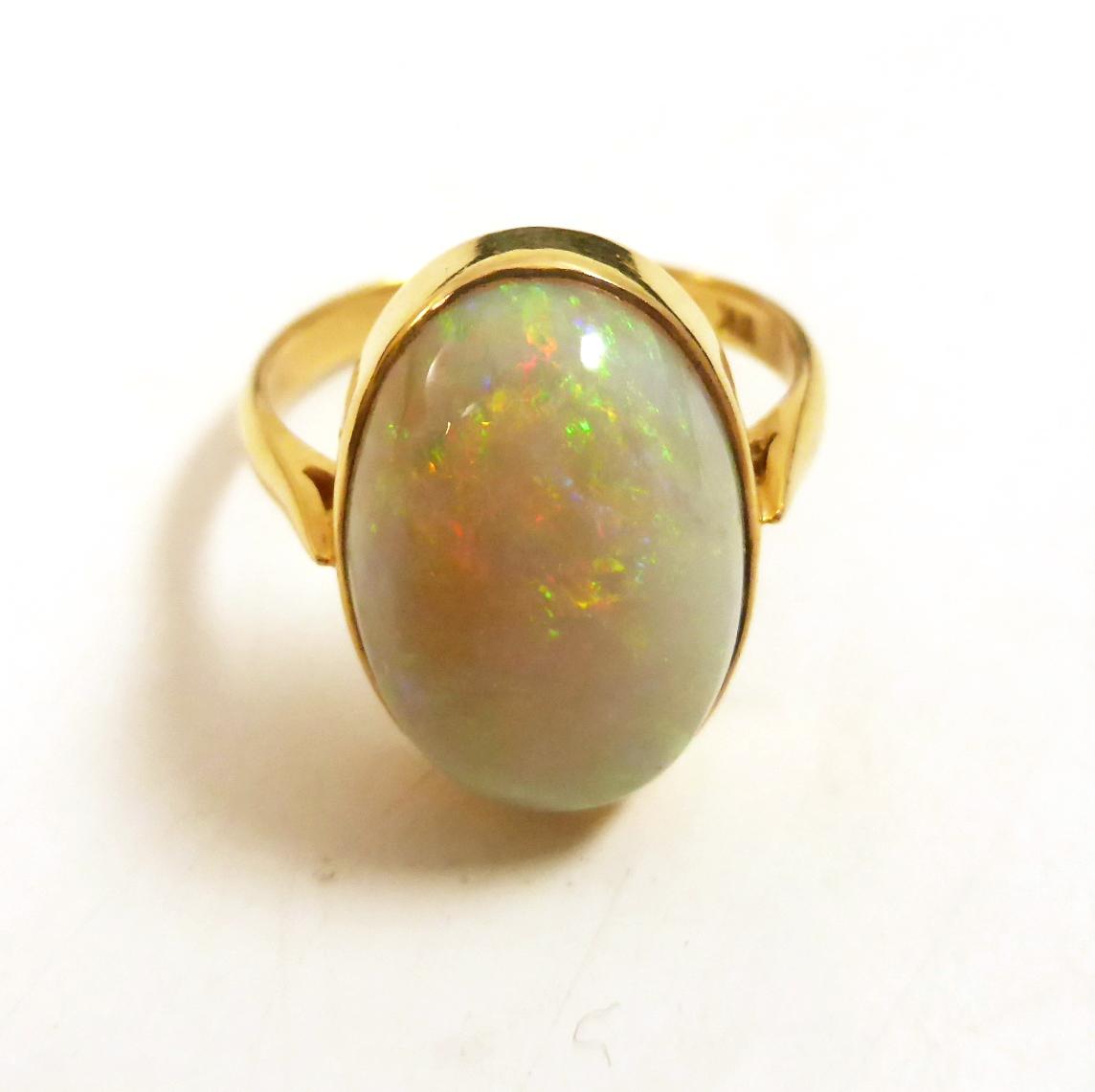 Lot 61 - An opal solitaire ring