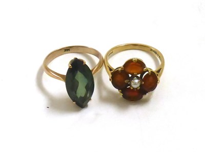 Lot 66 - A garnet and pearl cluster ring and a marquise ring (2)