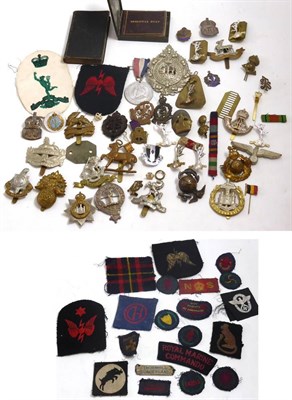 Lot 75 - A small quantity of cap badges, medals, etc