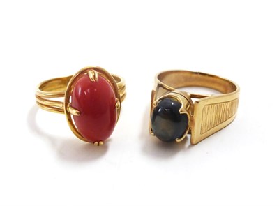 Lot 89 - A coral ring and a tigers eye ring (2)
