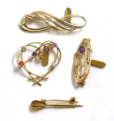 Lot 94 - Four brooches including; a 9ct gold dart, a 9ct gold swirl, a 9ct gold amethyst set, and a stylised