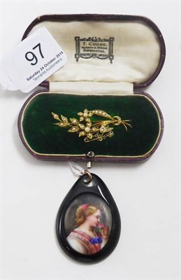 Lot 97 - An early 20th century floral brooch set with seed pearls, stamped '15ct', and a jet pendant...