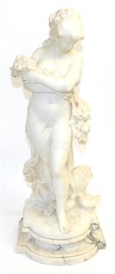 Lot 815 - H Marceau: An Alabaster Figure of a Girl, standing loosely dressed holding flowers, two doves...