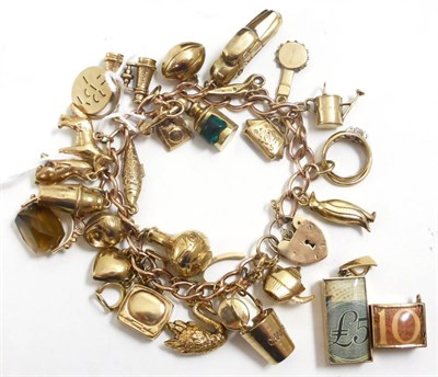 Lot 103 - A charm bracelet and two loose charms