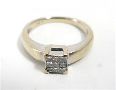 Lot 105 - An 18ct gold nine stone princess cut diamond cluster ring