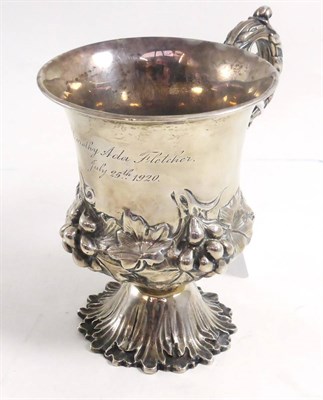Lot 111 - A silver footed mug with embossed decoration