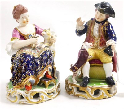 Lot 112 - A pair of Bloor Derby figures depicting a lady with cat and a gentleman with dog