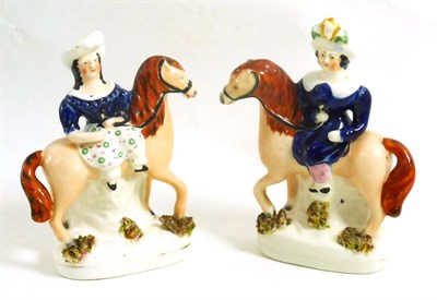 Lot 120 - A pair of early 19th century Staffordshire figures of maidens on horseback