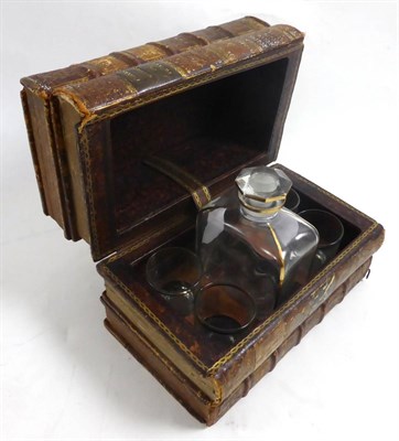 Lot 122 - An early 20th century novelty drinks set as a book stack