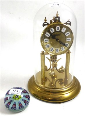 Lot 174 - Clock under dome and a glass paperweight