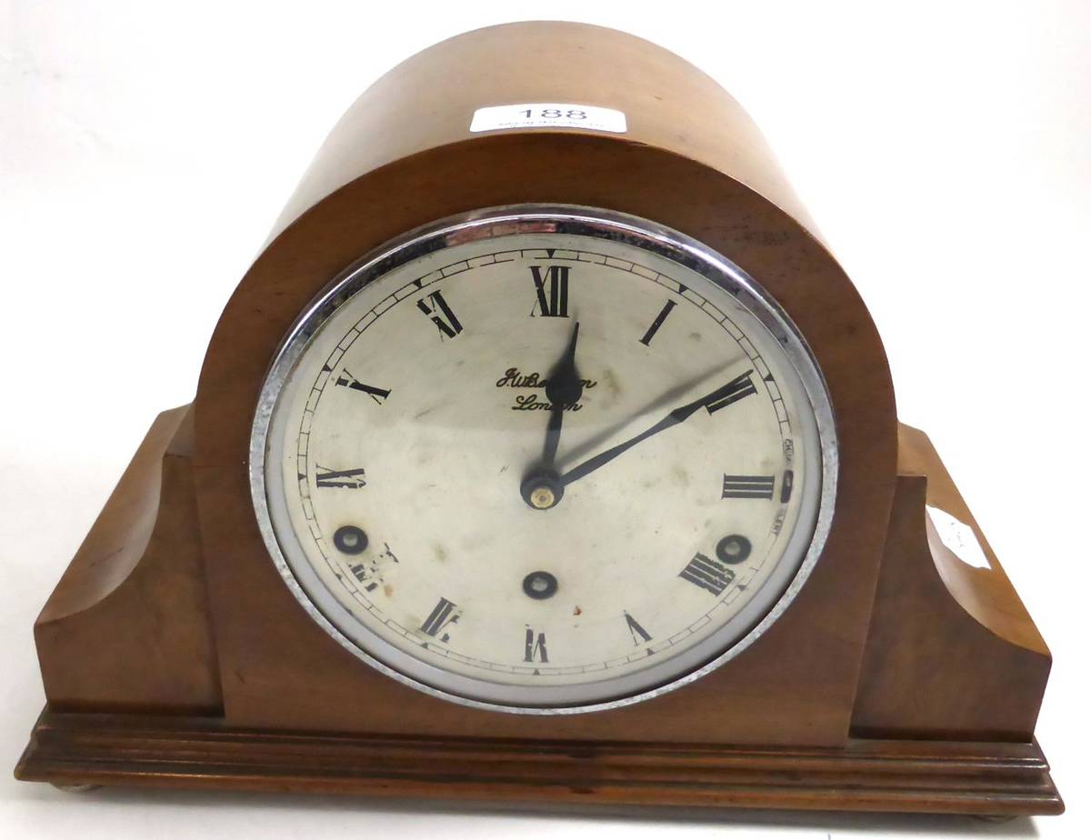 Lot 188 - A walnut veneered mantel clock