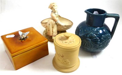 Lot 193 - A Royal Worcester figural basket, a cane ware tobacco box and cover, a Bretby type blue glazed...