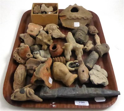 Lot 196 - A group of pre-Columbian terracotta figures and items including snake head fragment, lion...