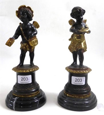 Lot 203 - A pair of cherub bronzes