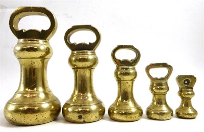 Lot 204 - A set of graduated brass weights