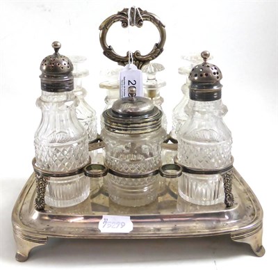 Lot 208 - A cut glass and silver seven piece condiment set on stand