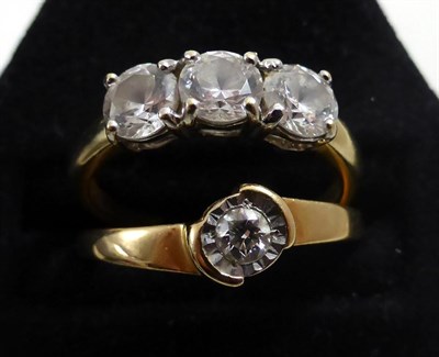 Lot 218 - A diamond solitaire ring and a 14ct gold three stone ring (2)