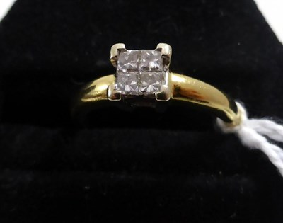 Lot 219 - An 18ct gold four stone princess cut diamond cluster ring