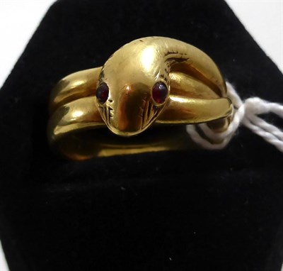 Lot 220 - A Victorian snake ring with garnet eyes, inscribed 'Mouse' to inner shank, 13gms