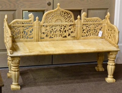 Lot 833 - A Carved Marble Bench, in Persian style, with pierced foliate decoration on fluted baluster...