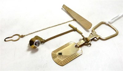 Lot 221 - A 9ct gold keyring, a diamond set stud and a 9ct gold tie slide