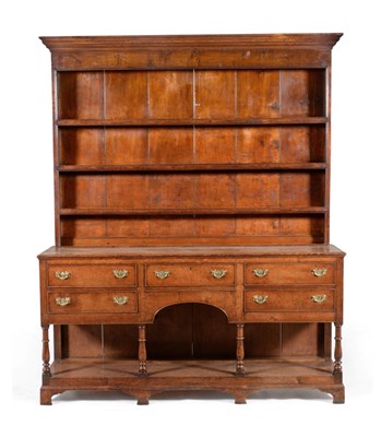 Lot 836 - A Late George III Oak Dresser and Rack, early 19th century, the bold cornice above three fixed...