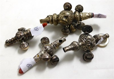 Lot 241 - Four silver baby rattles