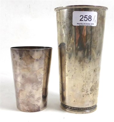 Lot 258 - A sterling silver presentation beaker and another plated example (2)