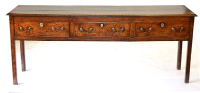 Lot 840 - A George III Oak Dresser, late 18th century, the plank top above three frieze drawers, raised...