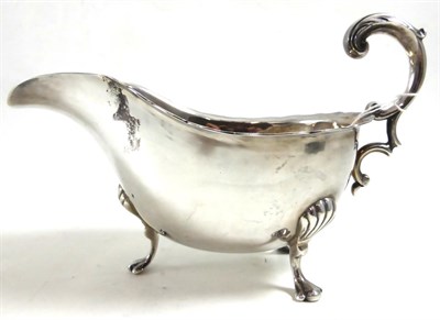 Lot 266 - A good George II style silver sauce boat, Sheffield 1937