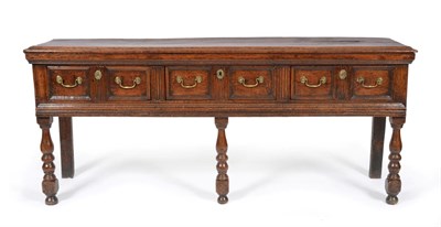 Lot 844 - A 17th Century Oak Three-Drawer Dresser, the moulded top above two-as-one moulded drawers and...