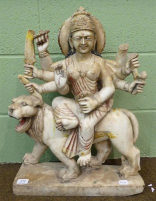 Lot 312 - A large Indian carved marble deity riding a lion