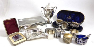 Lot 313 - Assorted small silver including a trophy cup, ashtray, salts, cigarette box, napkin rings etc