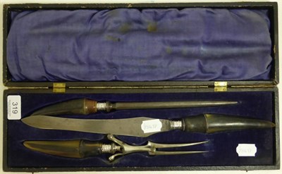 Lot 319 - A cased silver-mounted and horn-handled carving set