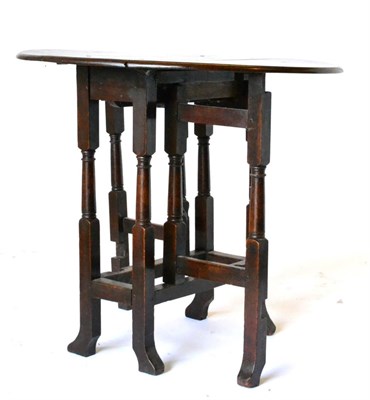 Lot 847 - An English Joined Oak Double Gateleg Table, circa 1690, with two rounded drop leaves to form an...