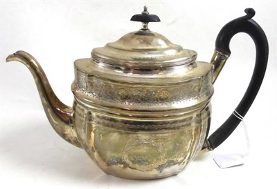 Lot 345 - A George III silver teapot, London 1803 (crest removed)