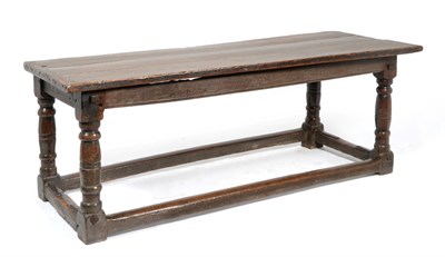 Lot 850 - A 17th Century Oak Refectory Dining Table, of three plank construction with cleated ends, raised on