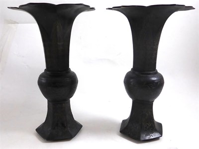 Lot 357 - A pair of late 19th century Chinese patinated bronze 'Gu' shape vases with flared petal rims, 28cm