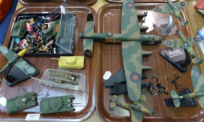 Lot 361 - A quantity of die cast aeroplanes, tanks and German Third Reich soldiers (on two trays)