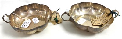 Lot 370 - A pair of silver twin handled bonbon dishes, Goldsmiths & Co