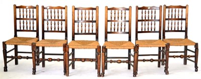 Lot 852 - A Harlequin Set of Six 19th Century Ash and Elm Rush-Seated Chairs, with double spindle back...