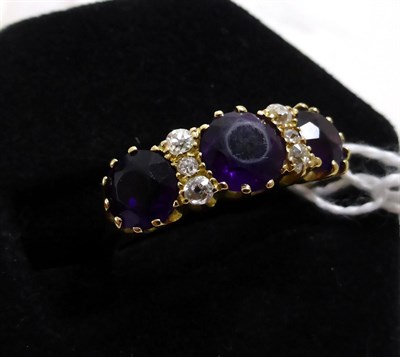 Lot 405 - An 18ct gold amethyst and diamond ring