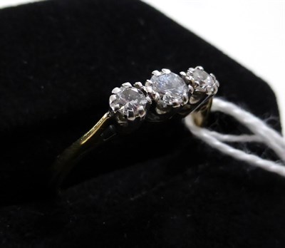 Lot 409 - A diamond three stone ring, stamped 'PLAT' and '18CT'