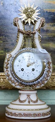 Lot 429 - A white marble and ormolu mounted striking lyre mantel clock, circa 1900, surmounted by a sun burst