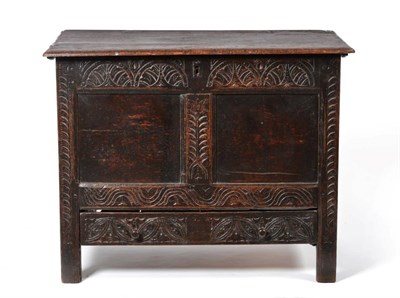 Lot 860 - A 17th Century Joined Oak Chest, the boarded hinged lid above a candle box, with lunette carved...