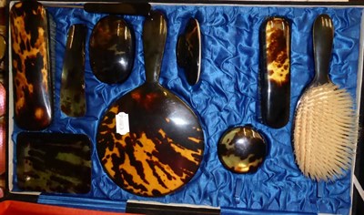 Lot 456 - An early 20th century tortoiseshell backed dressing table set retailed by Forsyth Ltd....