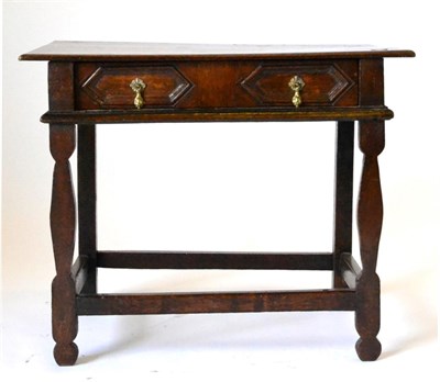 Lot 863 - An English Joined Oak Side Table, the boarded top above a two-as-one geometrically moulded...