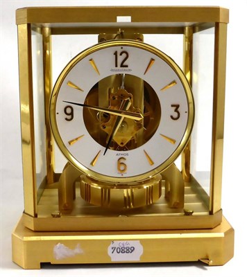 Lot 462 - An atmos clock, signed Jaeger LeCoultre, 20th century, white chapter ring with a skeletonised...